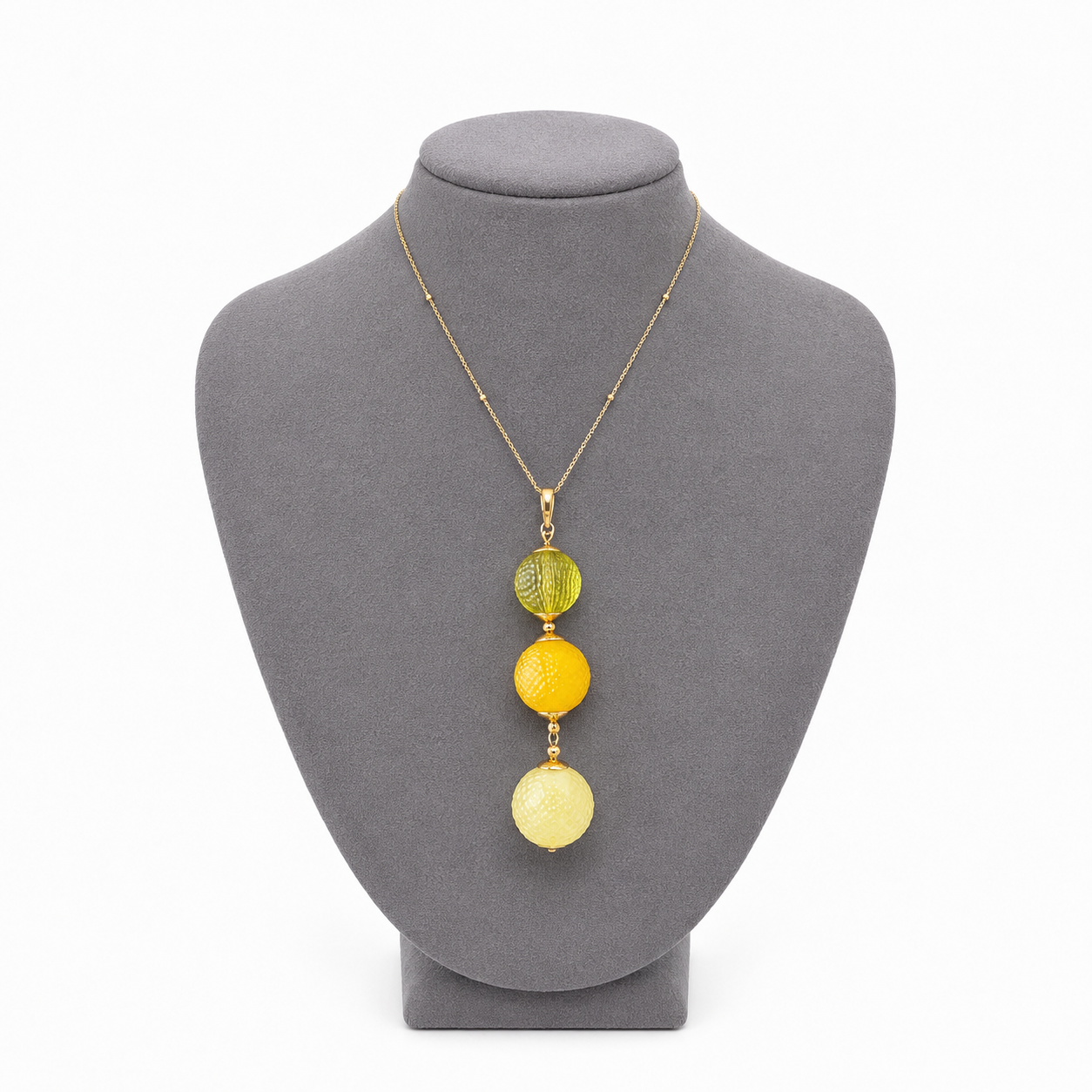 Model wearing Mélanie Baltic amber pendant necklace in lemon yellow amber — handcrafted in Lithuania by AMBER999 — Baltijos gintaro papuošalai, rankų darbas Lietuvoje
