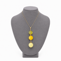 Model wearing Mélanie Baltic amber pendant necklace in lemon yellow amber — handcrafted in Lithuania by AMBER999