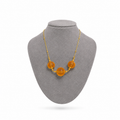 Model wearing Penete Baltic amber necklace in cognac amber — handcrafted in Lithuania by AMBER999
