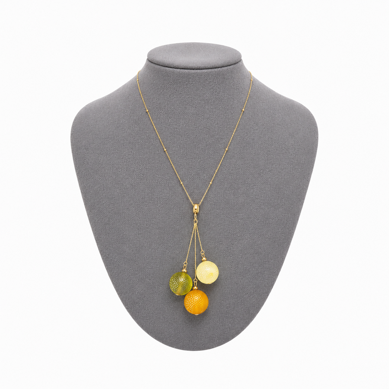 Model wearing Sidonie Baltic amber pendant necklace in cognac and cream amber — handcrafted in Lithuania by AMBER999
 — Baltijos gintaro papuošalai, rankų darbas Lietuvoje